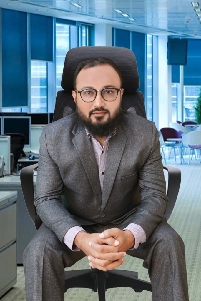 Portrait of Muhammad Irfan Reaz in a professional setting, wearing a business suit and smiling confidently.